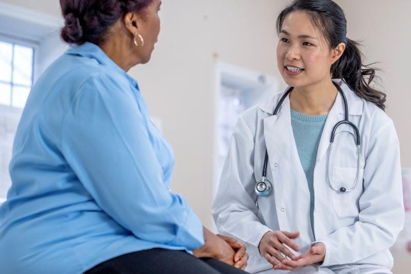 Care provider talking to patient